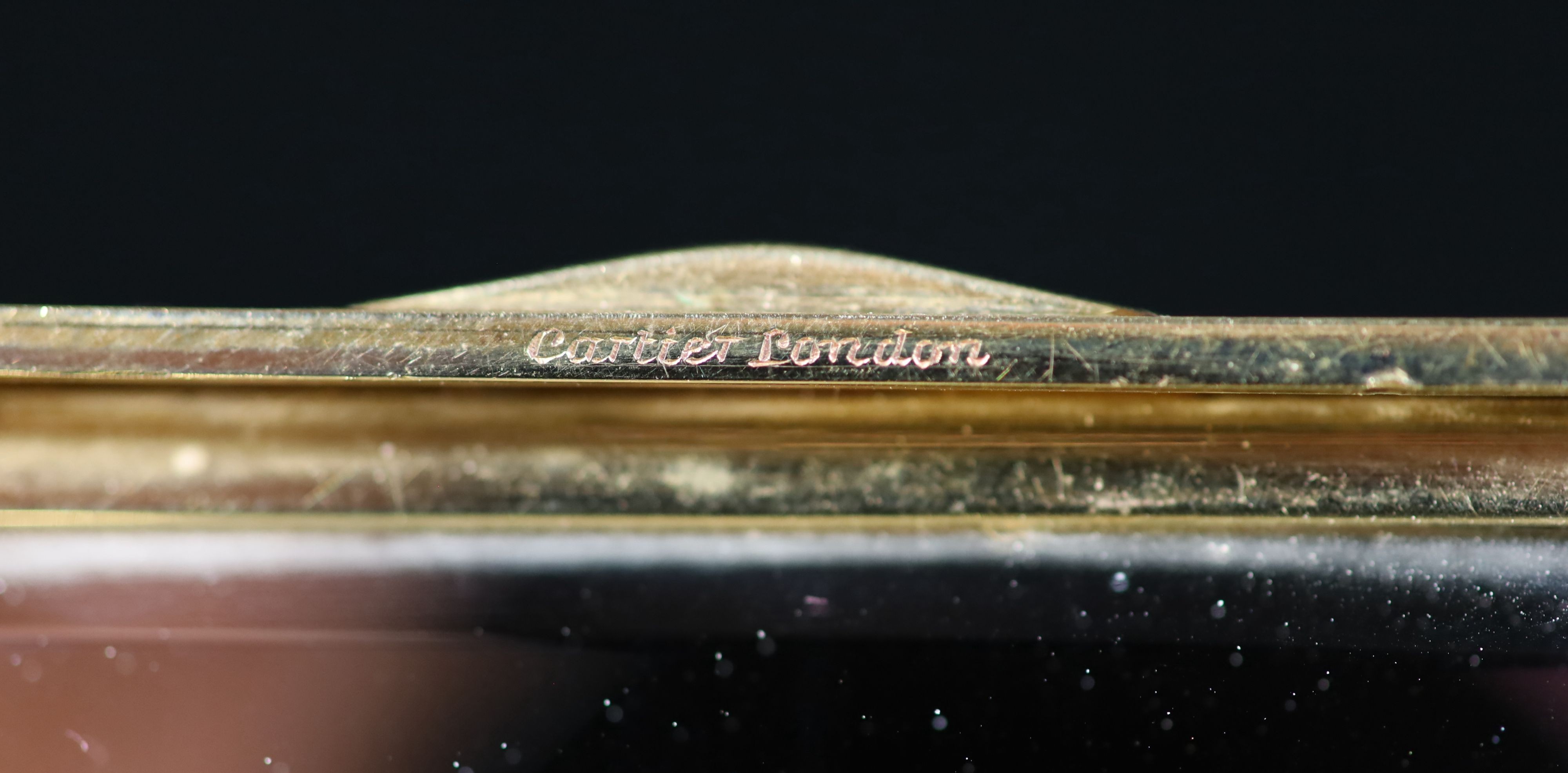 A 1930's Cartier 9ct gold compact, with diamond set thumbpiece